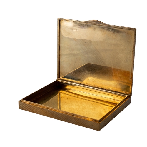 29 - CartierLondonCirca 1930A 9 carat gold rectangular boxWith ribbed decoration and diamond-set thumb pi... 