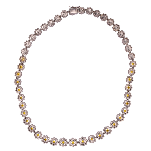 5 - EuropeanCirca 2000A fancy intense orange yellow diamond and white diamond necklaceComposed of slight... 