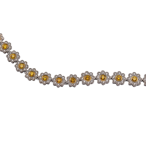 5 - EuropeanCirca 2000A fancy intense orange yellow diamond and white diamond necklaceComposed of slight... 