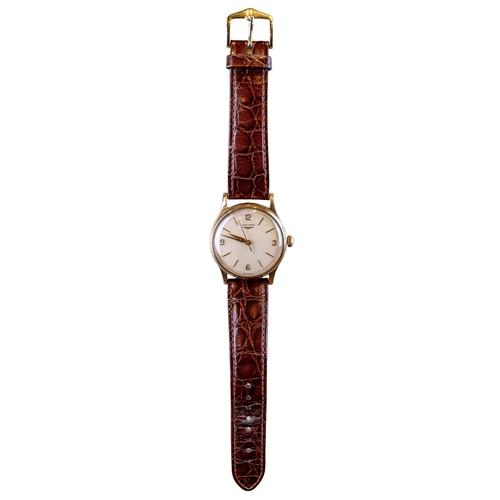 58 - Longines, SwissCirca 1950A 9 carat yellow gold wristwatch, with seconds sweep hand and gold numerals... 