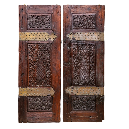 87 - Middle Eastern18th CenturyA pair of wooden doors, with studded brass furnishings From the Dr Mo... 