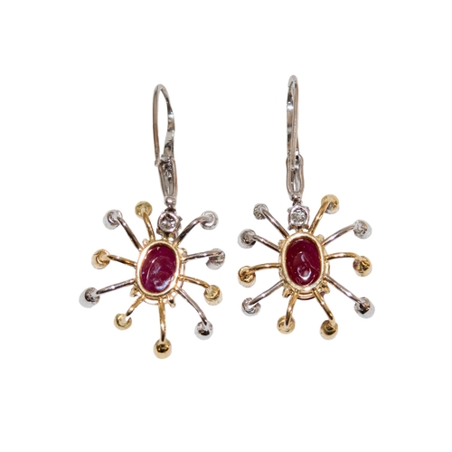 9 - BritishContemporaryA pair of ruby and diamond cluster earringsEach set to the centre with a single c... 