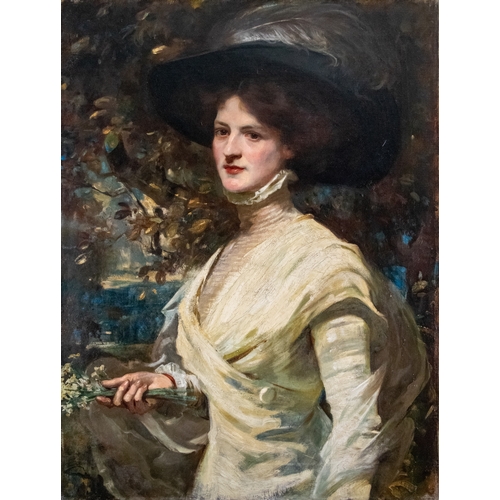 243 - Attributed to Edmond Brock (1882 - 1952)Portrait of a lady with flowers and a feathered hatOil on ca... 