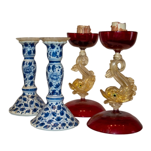 437 - Venetian [a] A pair of dolphin candlesticks [b] Along with a pair of modern blue and white candlesti... 