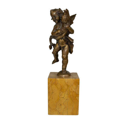 452 - ContinentalAfter the antiqueA bronze putti holding a dolphinGilded bronze on a marble baseDimensions... 