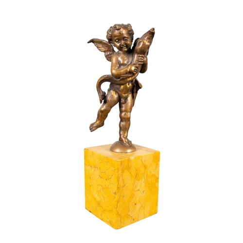 452 - ContinentalAfter the antiqueA bronze putti holding a dolphinGilded bronze on a marble baseDimensions... 