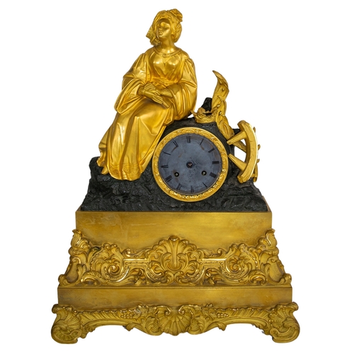 482 - ContinentalCirca 1850A bronze and ormolu mantel clock with St. Catherine of Alexandria martyred with... 