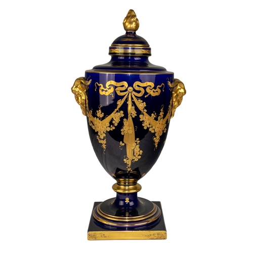 494 - FrenchSainte RadegondeEarly 20th CenturyA Blue of Tours and gilt urn, with decorative gilt goat head... 