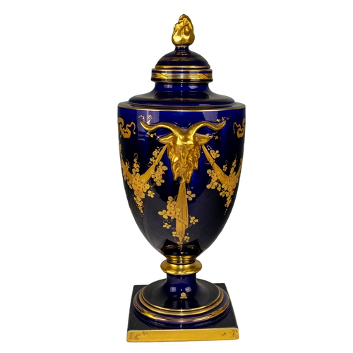 494 - FrenchSainte RadegondeEarly 20th CenturyA Blue of Tours and gilt urn, with decorative gilt goat head... 