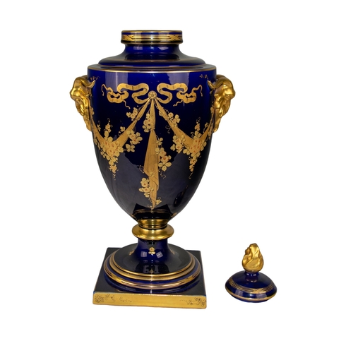 494 - FrenchSainte RadegondeEarly 20th CenturyA Blue of Tours and gilt urn, with decorative gilt goat head... 