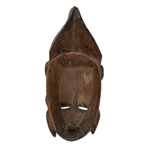 507 - West AfricanA carved wood maskTo be sold without reserveDimensions: 13 in. (H) x 5.5 in. (W)... 