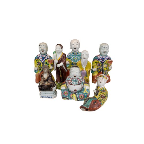 508A - Eight Chinese figuresTo include[a] Three seated laughing monk figures[b] One figure of a reclining l... 