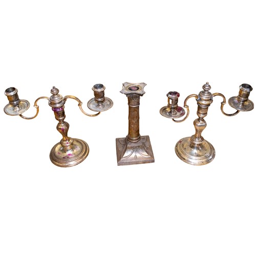 401A - Two candelabra and a singular brass candlestickTo be sold without reserveFrom the Gaia Servadio Coll... 