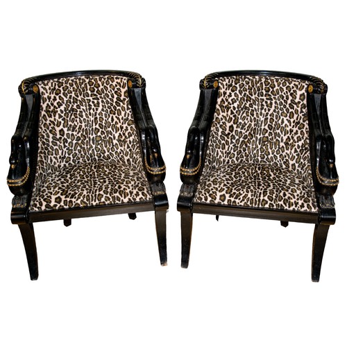 153 - Egyptomania1870-1900A pair of hardwood chairs, with swan fashioned arms and leopard upholsteryJapann... 