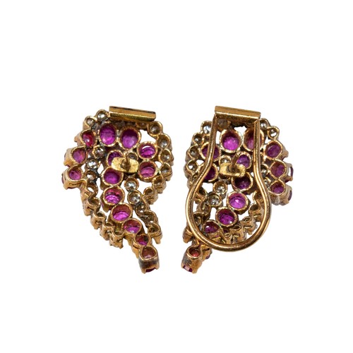 21 - IndianCirca 1960A pair of ruby and diamond scroll earringsMounted in yellow goldWeight: Approx. 11.9... 