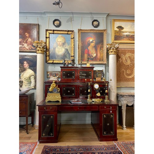 146 - Russianc.1820-40A brass mounted mahogany and ebony desk, with decorative inlaid wood panels with gil... 