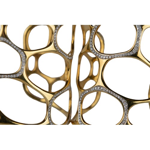 12 - GavelloMilanContemporaryA pair of 18 carat gold and diamond cuff banglesOf molecular design, the mol... 