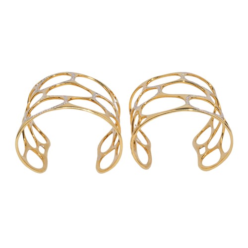 12 - GavelloMilanContemporaryA pair of 18 carat gold and diamond cuff banglesOf molecular design, the mol... 