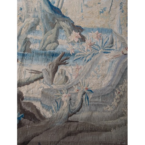 291 - FrenchEarly 18th CenturyA large verdure chinoiserie Aubusson tapestryWith an exotic bird in a river ... 