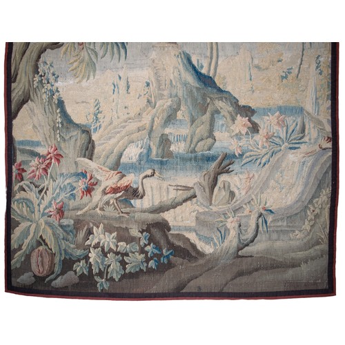 291 - FrenchEarly 18th CenturyA large verdure chinoiserie Aubusson tapestryWith an exotic bird in a river ... 