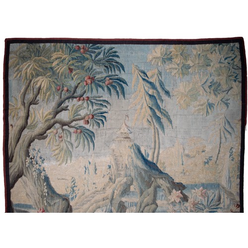 291 - FrenchEarly 18th CenturyA large verdure chinoiserie Aubusson tapestryWith an exotic bird in a river ... 