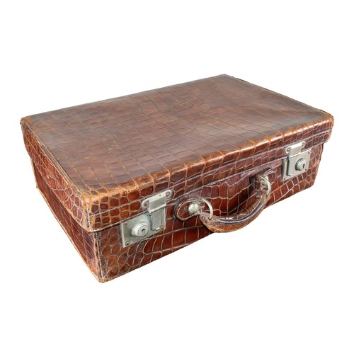 663 - British20th CenturyA crocodile skin travel case with brown lined interiorDimensions:7 in. (H) x 20 i... 