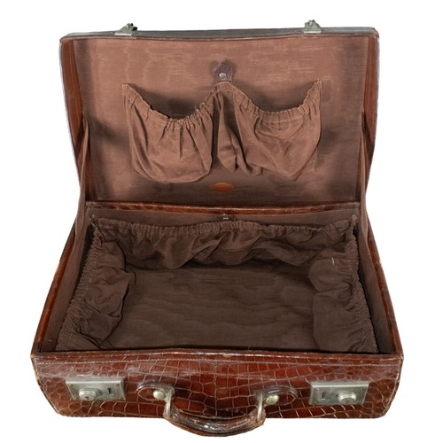 663 - British20th CenturyA crocodile skin travel case with brown lined interiorDimensions:7 in. (H) x 20 i... 