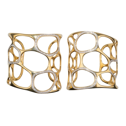 12 - GavelloMilanContemporaryA pair of 18 carat gold and diamond cuff banglesOf molecular design, the mol... 