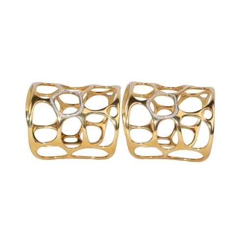 12 - GavelloMilanContemporaryA pair of 18 carat gold and diamond cuff banglesOf molecular design, the mol... 