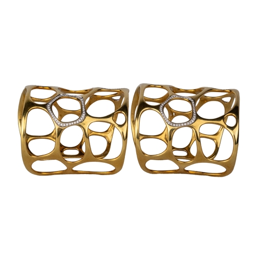 12 - GavelloMilanContemporaryA pair of 18 carat gold and diamond cuff banglesOf molecular design, the mol... 