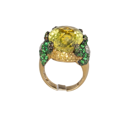 14 - ContinentalContemporaryA diamond, tsavorite garnet and lemon quartz dress ringThe oval briolette cut... 