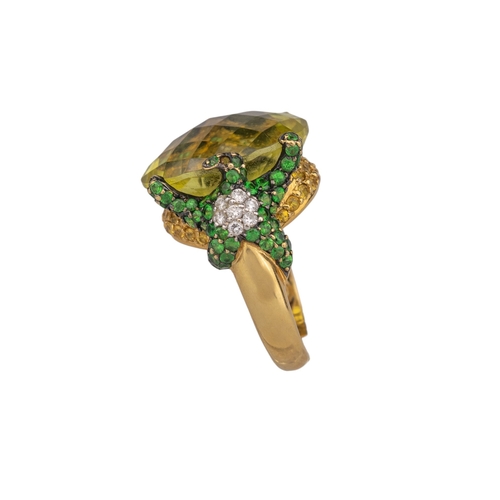 14 - ContinentalContemporaryA diamond, tsavorite garnet and lemon quartz dress ringThe oval briolette cut... 