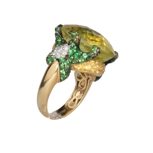 14 - ContinentalContemporaryA diamond, tsavorite garnet and lemon quartz dress ringThe oval briolette cut... 