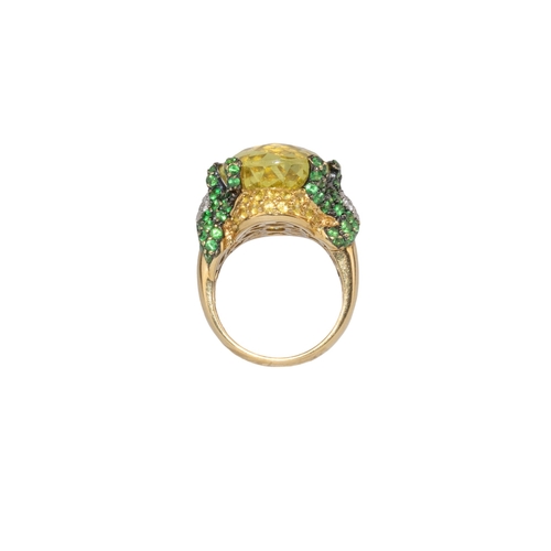 14 - ContinentalContemporaryA diamond, tsavorite garnet and lemon quartz dress ringThe oval briolette cut... 