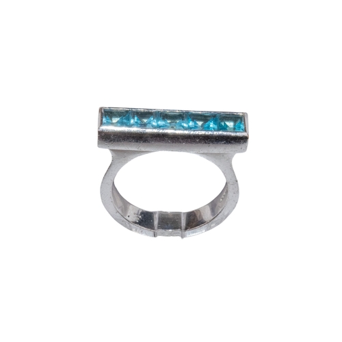 22 - Theo FennellCirca 2000A blue topaz 18 carat white gold strip ringRing size: L 1/2Weight: Approx. 9.2... 