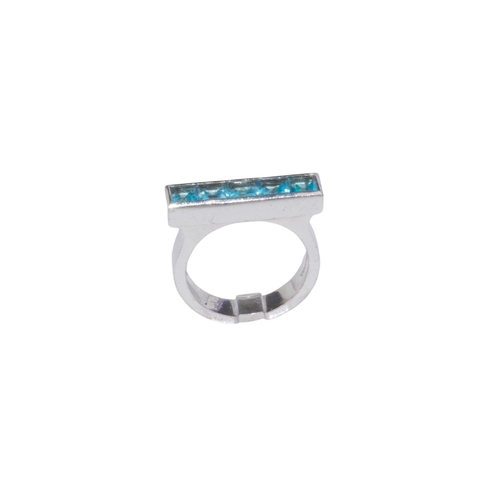 22 - Theo FennellCirca 2000A blue topaz 18 carat white gold strip ringRing size: L 1/2Weight: Approx. 9.2... 