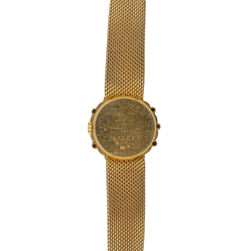 23 - KutchinskyCirca 1980A lady's 18 carat yellow gold and diamond wristwatchOn a milanese integral 18 ca... 