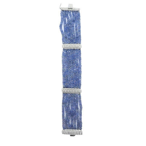 33 - ContinentalCirca 1990An attractive sapphire bead and diamond braceletThe bracelet composed of 7 rows... 