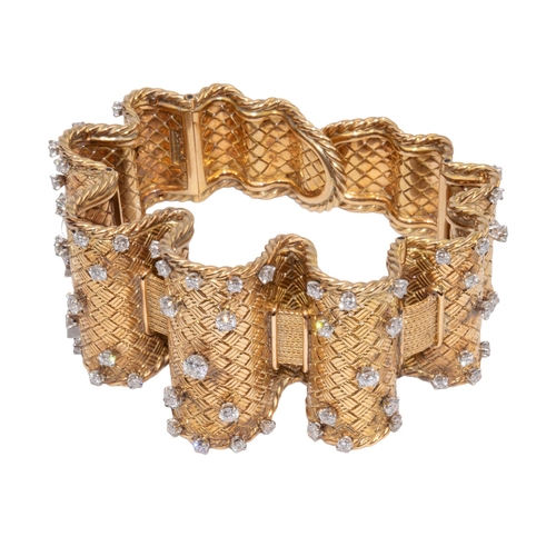 40 - FrenchCirca 1940A fine and opulent 18 carat gold and diamond flexible basket weave and wire twist ba... 