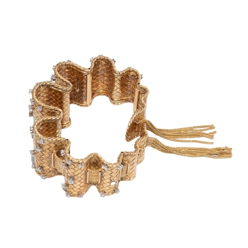 40 - FrenchCirca 1940A fine and opulent 18 carat gold and diamond flexible basket weave and wire twist ba... 