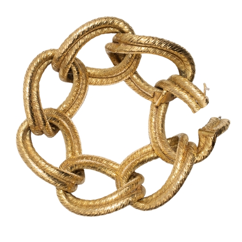 41 - HermèsParisCirca 1950An elegant French 18 carat gold oval curb link twisted wire work bracele... 