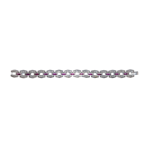 8 - EuropeanCirca 1940A diamond, ruby and platinum sectional bracelet The hexagonal sections set with di... 