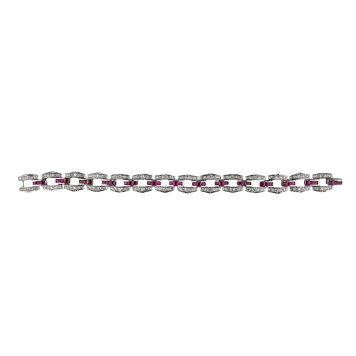 8 - EuropeanCirca 1940A diamond, ruby and platinum sectional bracelet The hexagonal sections set with di... 