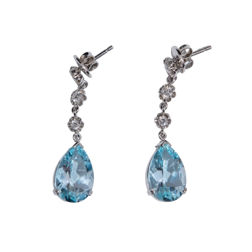 9 - ContinentalCirca 1980A pair of aquamarine and diamond pendant earringsThe pear shaped mixed cut aqua... 