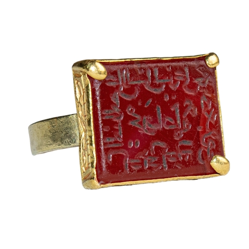 56 - Middle EasternAntiqueA fine gold engraved carnelian intaglio ringWith an Arabic inscriptionSet in a ... 