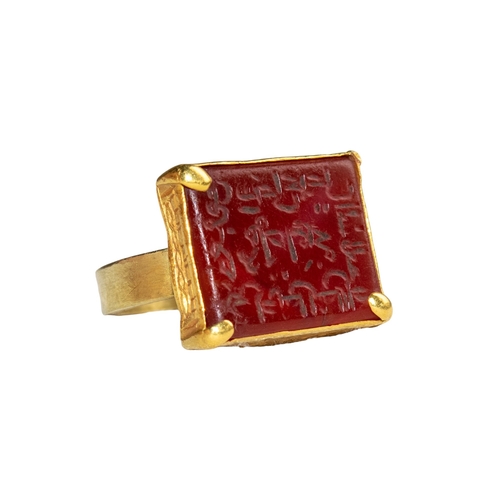 56 - Middle EasternAntiqueA fine gold engraved carnelian intaglio ringWith an Arabic inscriptionSet in a ... 