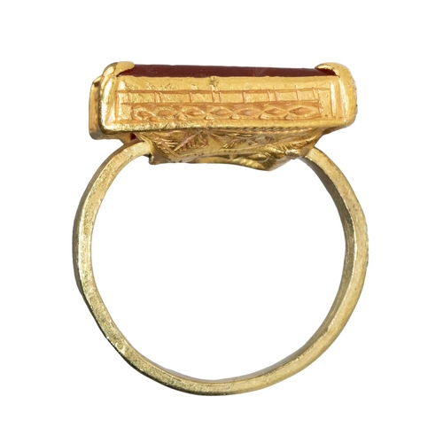 56 - Middle EasternAntiqueA fine gold engraved carnelian intaglio ringWith an Arabic inscriptionSet in a ... 