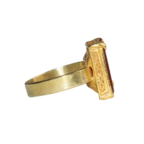 56 - Middle EasternAntiqueA fine gold engraved carnelian intaglio ringWith an Arabic inscriptionSet in a ... 