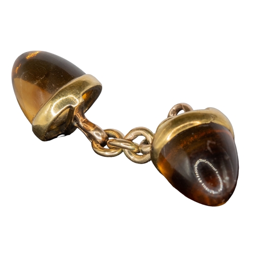 64 - ContinentalArt DecoCirca 1930A pair of sugar loaf citrine and yellow gold cufflinksWeight: Approx. 9... 