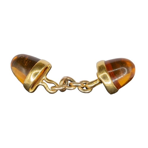 64 - ContinentalArt DecoCirca 1930A pair of sugar loaf citrine and yellow gold cufflinksWeight: Approx. 9... 